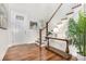 Bright entryway featuring hardwood floors, staircase, and stylish decor at 14228 Twin Eagles Ln, Charlotte, NC 28278