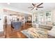 Open-concept living space with hardwood floors and seamless flow to the kitchen and dining area at 14228 Twin Eagles Ln, Charlotte, NC 28278
