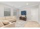 Cozy living room with beige sofa, decorative rug, and stylish decor at 14228 Twin Eagles Ln, Charlotte, NC 28278