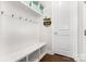 Mudroom with built-in storage bench and coat hooks at 14228 Twin Eagles Ln, Charlotte, NC 28278