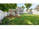 Lush backyard featuring a pergola-covered patio with comfortable seating and landscaping, perfect for outdoor enjoyment at 1446 Downs Ave, Charlotte, NC 28205
