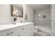 Bathroom featuring a white vanity with marble countertop and a tiled shower-tub combination at 1446 Downs Ave, Charlotte, NC 28205