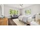 Bright bedroom with hardwood floors, lots of natural light, and a gray sofa at 1446 Downs Ave, Charlotte, NC 28205