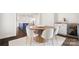 Open dining area showcasing a round wood table, six chairs, hardwood floors, and a wine refrigerator at 1446 Downs Ave, Charlotte, NC 28205