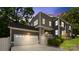Stunning two-story home featuring a gray exterior with a spacious two-car garage and manicured landscaping at 1446 Downs Ave, Charlotte, NC 28205