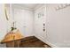Bright foyer with hardwood floors, modern console table, and white trim at 1446 Downs Ave, Charlotte, NC 28205