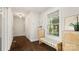 Hallway with hardwood floors, natural light, and a built-in bench at 1446 Downs Ave, Charlotte, NC 28205