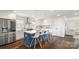 Modern kitchen with a blue center island, stainless steel appliances, and white cabinetry at 1446 Downs Ave, Charlotte, NC 28205