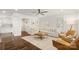 Open living room boasting hardwood floors, neutral decor, and large windows at 1446 Downs Ave, Charlotte, NC 28205