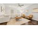Bright living room featuring neutral furniture, hardwood floors, and natural light at 1446 Downs Ave, Charlotte, NC 28205