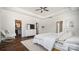 Large primary bedroom features a closet, sitting chair, and hardwood floors at 1446 Downs Ave, Charlotte, NC 28205