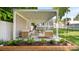 Outdoor patio area with pergola, stylish furniture, and manicured landscaping for outdoor relaxing and entertaining at 1446 Downs Ave, Charlotte, NC 28205