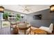 Inviting covered porch with comfortable seating, a ceiling fan, and a mounted television for outdoor enjoyment at 1446 Downs Ave, Charlotte, NC 28205