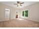 Cozy bedroom featuring hardwood floors, natural light from a window, and a closet with an ensuite bathroom at 1500 Tarrington Way, Wesley Chapel, NC 28079