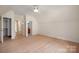 Bedroom featuring hardwood floors and multiple doorways leading to other rooms in the house at 1500 Tarrington Way, Wesley Chapel, NC 28079