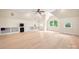 Bonus room with hardwood floors and multiple windows allowing ample natural light in the space at 1500 Tarrington Way, Wesley Chapel, NC 28079
