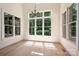 Bright dining area with large windows offering scenic views and ample natural light at 1500 Tarrington Way, Wesley Chapel, NC 28079