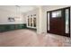 Elegant entryway boasting hardwood floors, wainscoting, and a stained-glass front door at 1500 Tarrington Way, Wesley Chapel, NC 28079