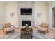 Elegant fireplace with stone surround, perfect for cozy evenings and showcasing wall decor at 1500 Tarrington Way, Wesley Chapel, NC 28079