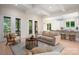Open living space seamlessly blends a seating area with an adjacent kitchen for modern living at 1500 Tarrington Way, Wesley Chapel, NC 28079