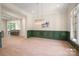 Spacious living room featuring hardwood floors and access to an open-concept kitchen at 1500 Tarrington Way, Wesley Chapel, NC 28079