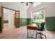 Spacious home office with wainscoting, hardwood floors, and ample natural light at 1500 Tarrington Way, Wesley Chapel, NC 28079