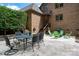 Brick patio with outdoor seating perfect for entertaining guests at 1500 Tarrington Way, Wesley Chapel, NC 28079