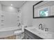 Updated bathroom with a sleek vanity, subway tiled shower and modern fixtures at 1739 16Th Ne St, Hickory, NC 28601