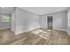 A light-filled bedroom showcasing modern wood-look floors and neutral walls at 1739 16Th Ne St, Hickory, NC 28601