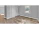 A well-lit bedroom with a closet, neutral paint, and wood-look floors at 1739 16Th Ne St, Hickory, NC 28601