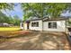 Attractive single-story home with a black framed windows, a yard and a paved driveway at 1739 16Th Ne St, Hickory, NC 28601