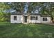 Charming home with a well-manicured lawn and a freshly painted exterior and black trim at 1739 16Th Ne St, Hickory, NC 28601