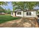 Charming home with a well-manicured lawn and a freshly painted exterior and black trim at 1739 16Th Ne St, Hickory, NC 28601