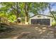 Detached two-car garage with driveway, basketball hoop, and carport at 1739 16Th Ne St, Hickory, NC 28601