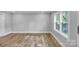 Bright living room features wood floors, neutral paint, and large windows at 1739 16Th Ne St, Hickory, NC 28601
