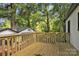 Wood deck overlooking backyard with mature trees and landscaping at 1739 16Th Ne St, Hickory, NC 28601