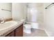 Bathroom featuring a single vanity, a toilet, and a shower-tub combo at 178 Wellshire St, Mooresville, NC 28115