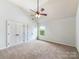 Bedroom showcasing double closets and a ceiling fan that allows natural light from the outside window at 178 Wellshire St, Mooresville, NC 28115