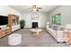 Inviting living room featuring a cozy fireplace, stylish furnishings, and plenty of natural light at 178 Wellshire St, Mooresville, NC 28115