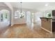 An open-concept living room boasts abundant light and a versatile tile floor at 178 Wellshire St, Mooresville, NC 28115