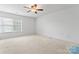 Bright, spacious bedroom featuring neutral walls, carpet, and a ceiling fan at 1911 Savannah Hills Dr, Matthews, NC 28105