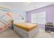 Bedroom featuring painted walls, carpet, a ceiling fan, and a writing desk at 1911 Savannah Hills Dr, Matthews, NC 28105