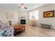 Bright living room with a cozy fireplace, neutral paint, and comfortable seating at 1911 Savannah Hills Dr, Matthews, NC 28105
