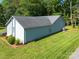 Aerial view showcasing the side of a home with a well-maintained lawn and mature trees at 2011 20Th Street Ne Pl, Hickory, NC 28601