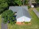 One-story home seen from above, featuring a well-kept roof, mature trees, and green surroundings at 2011 20Th Street Ne Pl, Hickory, NC 28601