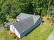 Aerial view of the home highlighting the manicured lawn, surrounding foliage, and home exterior at 2011 20Th Street Ne Pl, Hickory, NC 28601