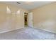 Spacious carpeted bedroom with an entry doorway and neutral paint throughout at 2011 20Th Street Ne Pl, Hickory, NC 28601