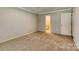 Neutral carpeted bedroom with adjoining doorways, grey walls and light trim at 2011 20Th Street Ne Pl, Hickory, NC 28601