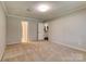 Spacious carpeted bedroom with multiple doorways and light grey paint throughout at 2011 20Th Street Ne Pl, Hickory, NC 28601