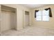 Cozy bedroom featuring neutral carpet, a window for natural light, and roomy double closets at 2011 20Th Street Ne Pl, Hickory, NC 28601